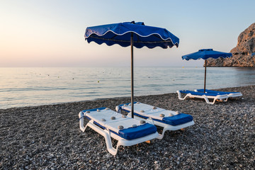 The main beach of Kolymbia, a sun-soaked resort in an idyllic place between mountains and the sea. Rhodes, Greece.