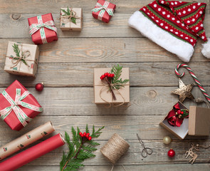 Wrapping Christmas gifts on wooden background, Christmas box.