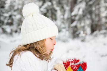 Happy child in winter park