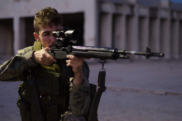 Sniper with headset aim target night outdoor