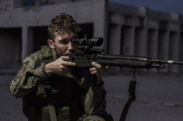 Sniper with headset aim target night outdoor