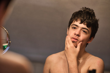 braces teen in mirror