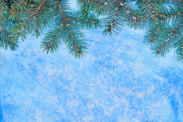 Christmas blue background with a pinecones and snow