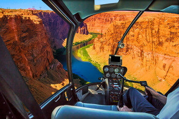 Helicopter cockpit with pilot arm and control console inside the cabin on the Grand Canyon Lake Powell. Reserve on the Colorado River, straddling the border between Utah and Arizona. USA, America. © bennymarty