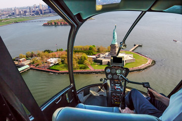 Helicopter flight view of Liberty Island and the famous Statue of Liberty monument symbol of New...
