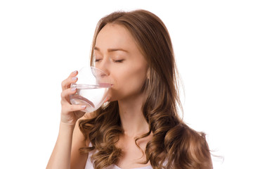 Beautiful young woman holding glass of water health