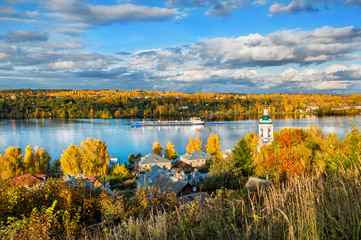 View of the Volga River in the autumn Plyos and the temple on the shore Вид на реку Волгу в осеннем Плёсе и храм на берегу