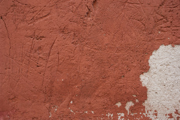 Background witn peeling red color. Old, grange wall. Wallpaper textured urban.