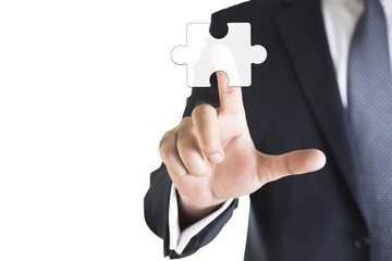 Mergers and acquisition concept with consultant touching icons of puzzle pieces representing the merging of two companies or joint venture, partnership 