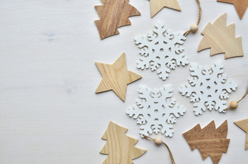 wooden christmas trees, snowflakes, and stars background