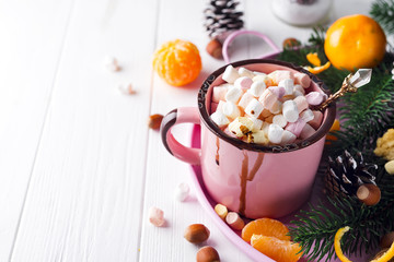 Red mug with hot chocolate with melted marshmallow