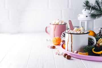 two cups with hot chocolate or cocoa with melted marshmallow