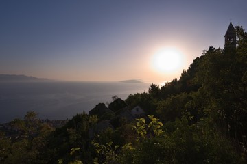 Abandoned stone mediaeval village in the Biokovo mountains in balkan country Croatia in Dalmatia region with beautiful view on the Adriatic sea. Picture taken in hot summer day at the sunset.
