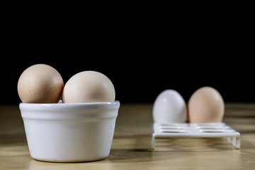 Egg, milk and jug on the kitchen table. Kitchen table with food products.