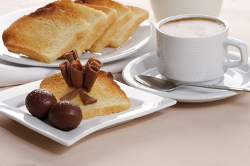 Breakfast with coffee, toasts, and chocolate