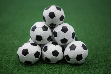 Stack of piled up football soccer balls