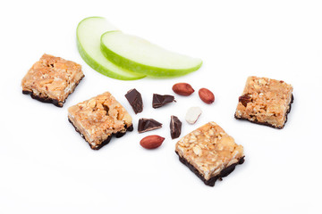 Cereal bar bits apple chocolate and peanuts