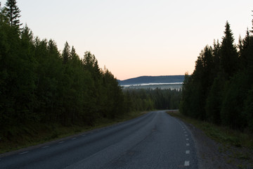 Fototapeta premium Typical road in Scandinavia, Polar day, Northern Finland