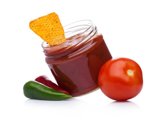 Glass container with hot pepper salsa dip nachos