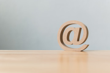 Email address icon wooden symbol, Contact us customer service by email concept