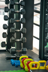 Fitness equipment with black and colorful dumbells