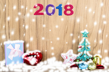 christmas decoration and 2018 on wood background