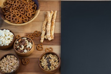Various snacks on wooden table