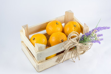 a small crate with tangerines