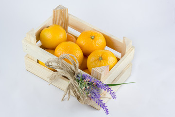 a small crate with tangerines