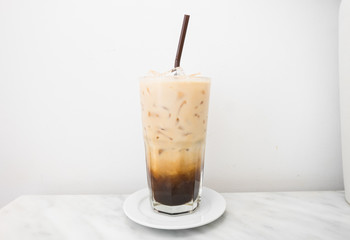 ice latte macchiato coffee in glass on the table with white background.