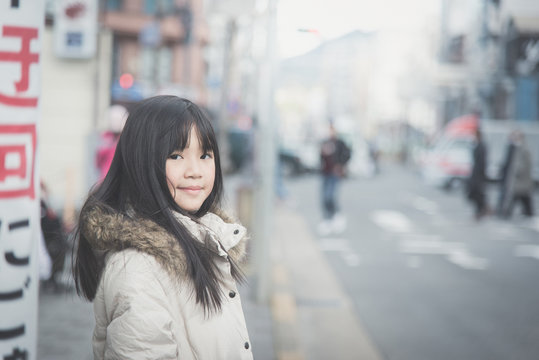 asian girl walking in the street. Kyoto Japan
