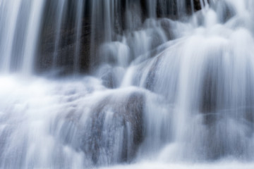 Fototapeta na wymiar Waterfall flowing on limestone