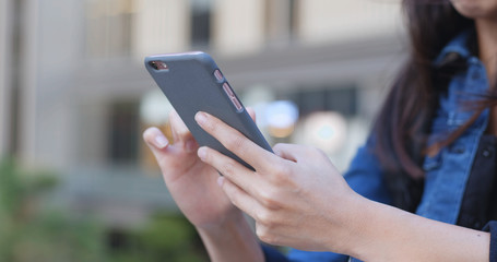 Woman use of smart phone in the park