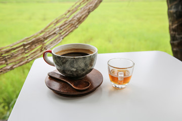 Hot coffee in cup, Hot amaricano among cornfield