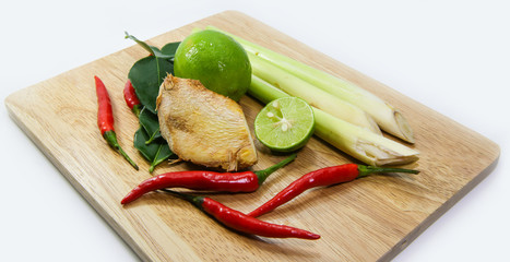 ginger, lemograss, onion, lime leaves, chilli, lemon, Fresh herbs and spices asian ingredients food on block on white background , thai food