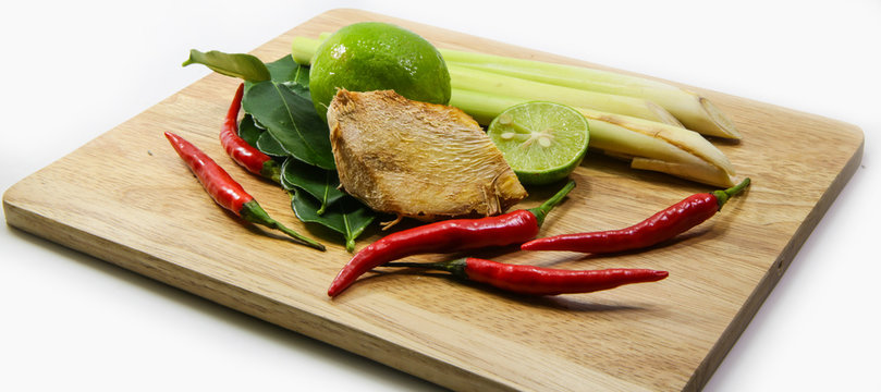 ginger, lemograss, onion, lime leaves, chilli, lemon, Fresh herbs and spices asian ingredients food on block on white background , thai food