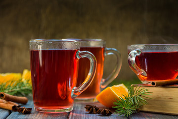 Red tea with orange fruit and spices