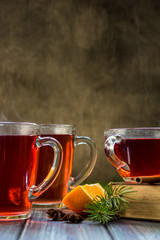 Red tea with orange fruit and spices