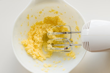Mixing or creaming butter and sugar with electric beater