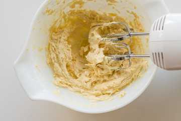 Mixing ingredients for batch of biscuits