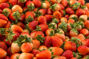 Group of fresh organic strawberry macro. Fruit background
