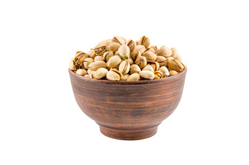 Bowl with pistachios isolated on a white.
