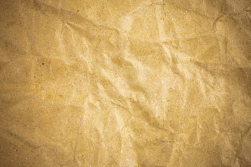 Vignette brown crumpled paper.