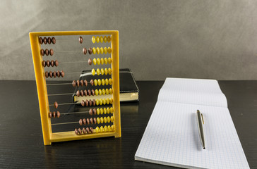 Calculations on an old abacus.