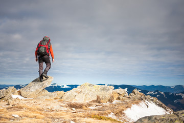 The man climbed to the top of the mountain.