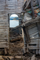 Fototapeta na wymiar Interior of ruined abandoned house at Shiroka Polyana lake, Bulgaria
