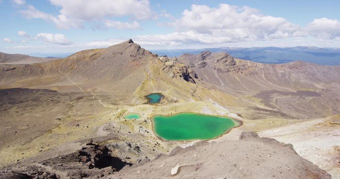 New Zealand Landscape Nature Of Emerald Lakes In Tongariro Alpine Crossing. Stunning volcanic landscape, a famous tourist attraction qnd destination of North Island of New Zealand. SLOW MOTION.