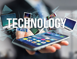 Technology title surounded by device like smartphone, tablet or laptop - Internet and communication concept