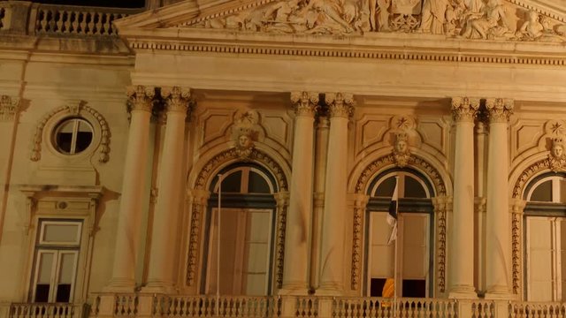 Ultra close-up shot of the Town Hall - Pacos do Concelho - Museu do Dinheiro in Lisbon, Portugal. The neoclassical facade features a balcony with sculptures.