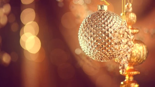 Christmas and New Year golden decoration. Abstract blinking holiday background. Slow motion 4K UHD video footage. 3840X2160